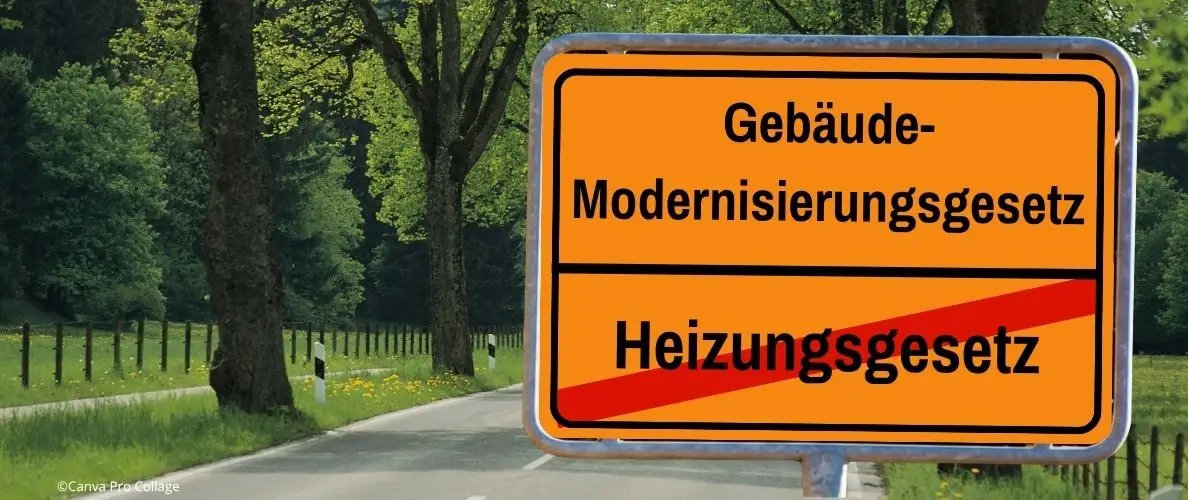 Orangefarbenes Ortsschild mit Gebäudemodernisierungsgesetz ersetzt Heizungsgesetz