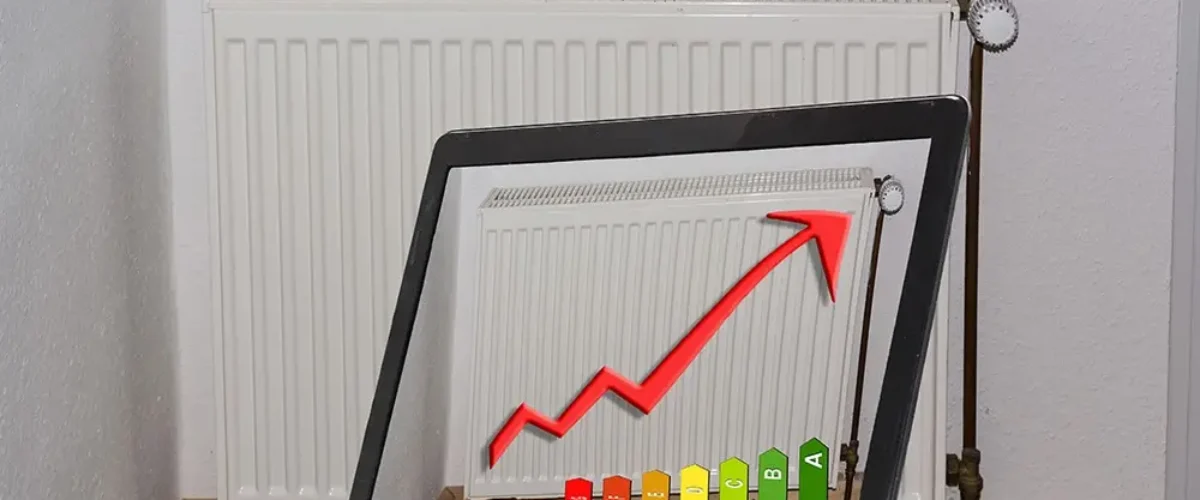 Laptop with image of a radiator and diagram on the monitor. Concept Save heating costs, construction planning and architecture.
